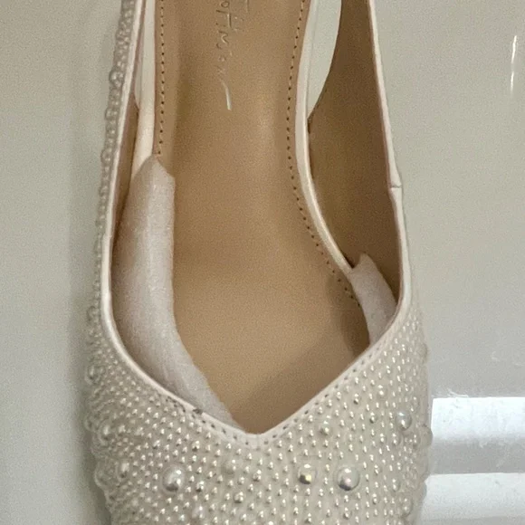 Two bridal gowns in excellent condition.Plus shoes.